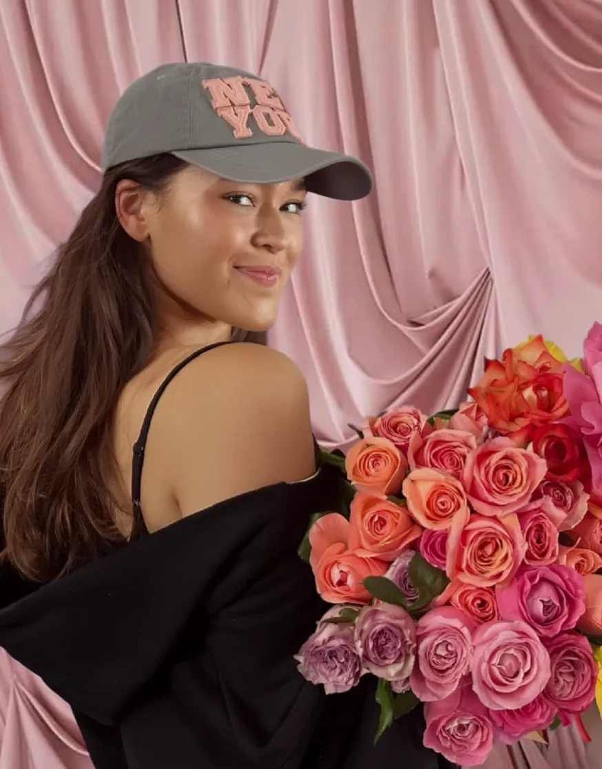 Tamsyn Sollier-Smith holding a bouquet of roses